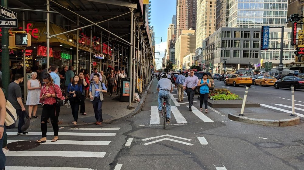Try to cycle on the sidewalk here and you would bump into everyone. For how wide the avenues of Manhattan are, very little space is allocated to people; they are even overflowing into the bike lane!