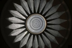 A crystal chandelier hangs beneath a nineteen meter dome
